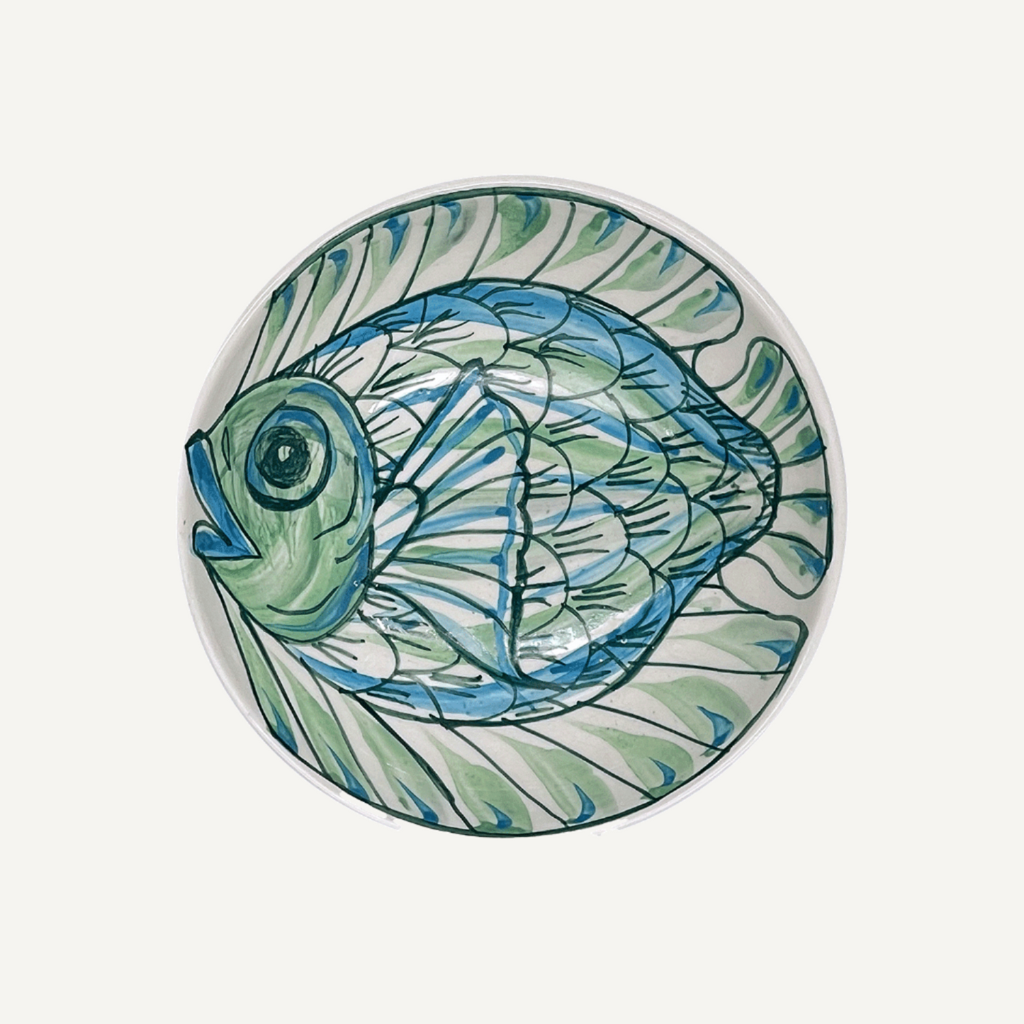 Ciotola di arachidi con pesce verde Romina
